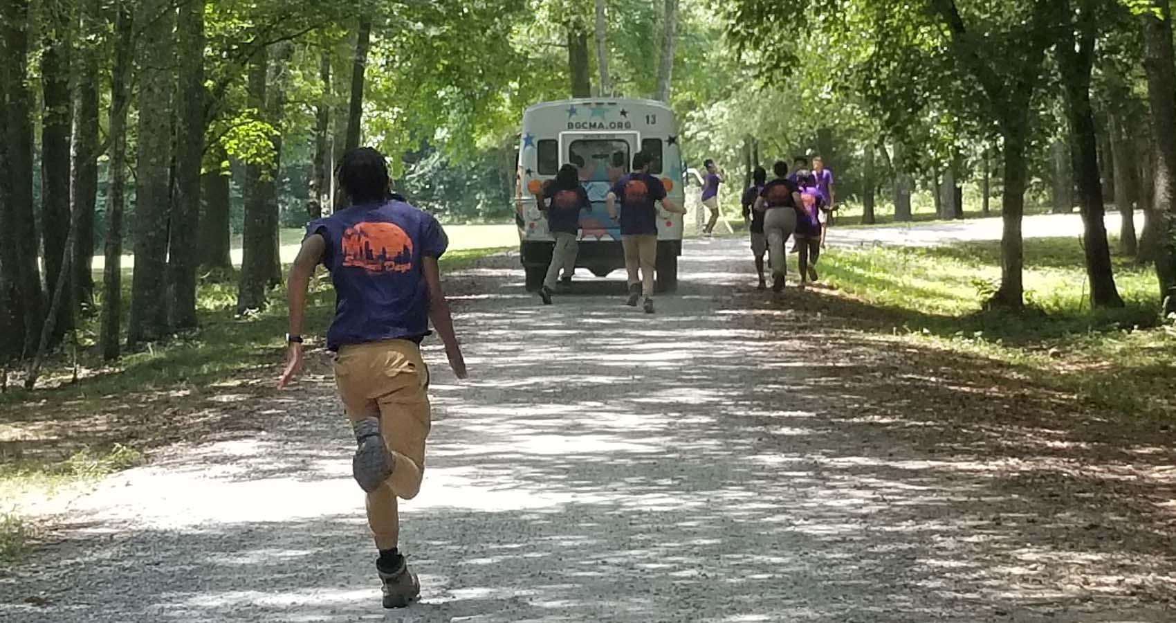 staff running to great camper bus