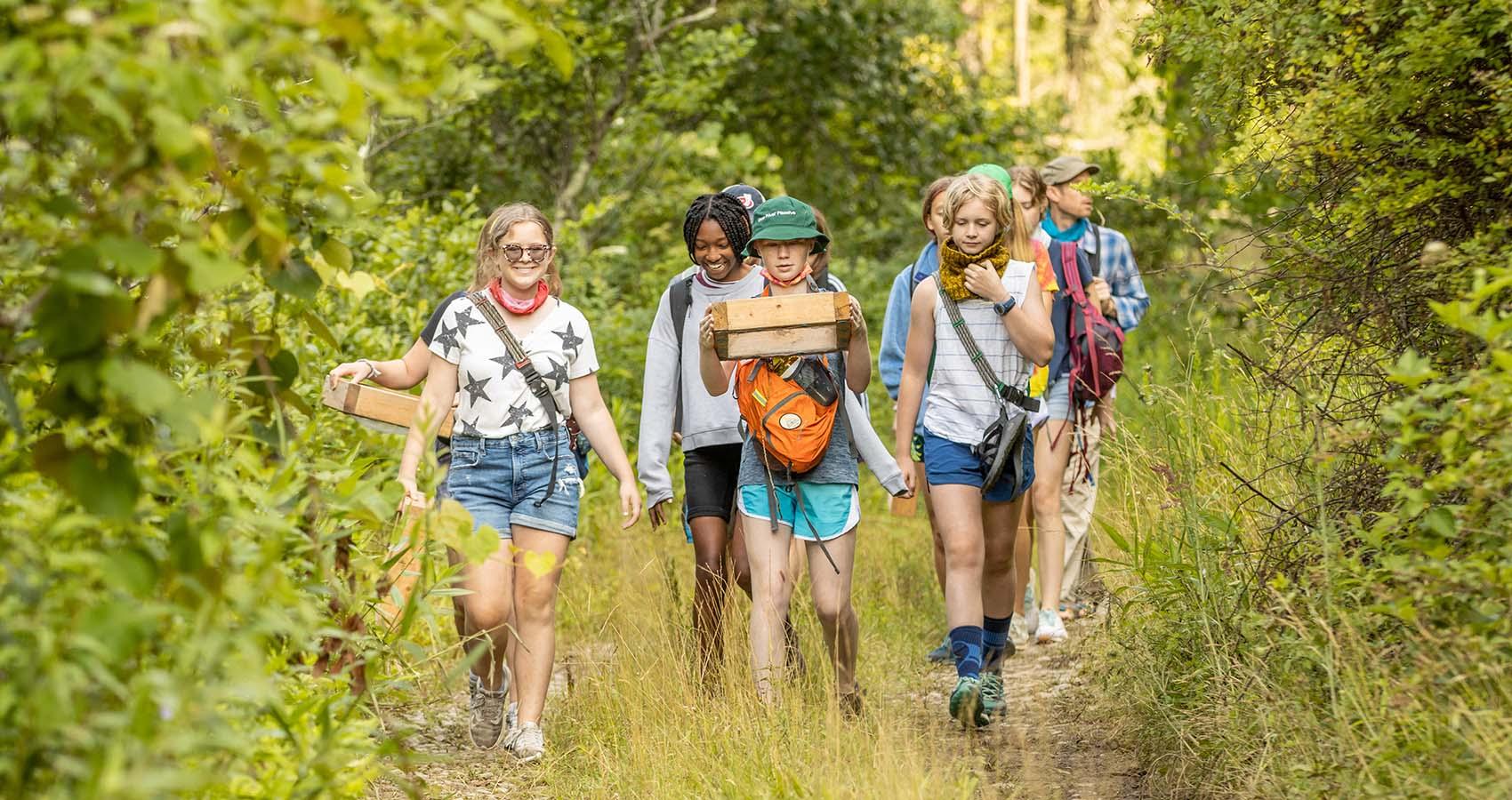 campers hiking on trail