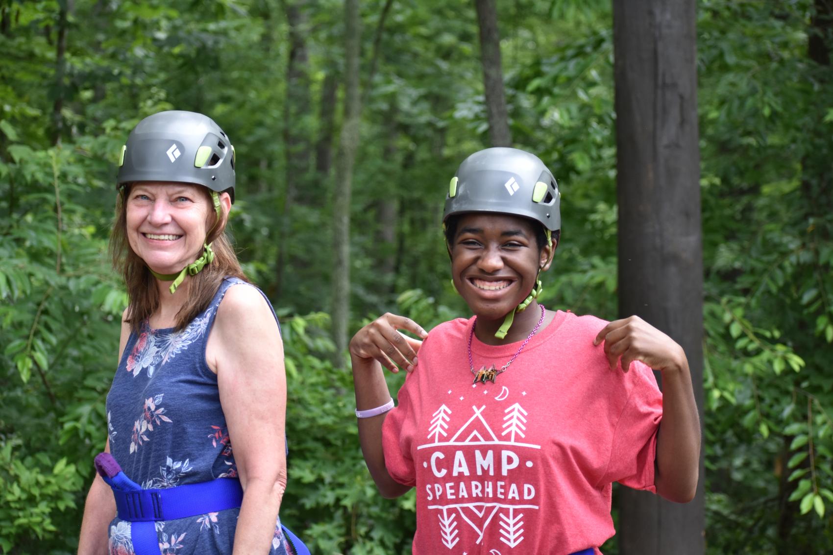 camper and staff wearing helmets