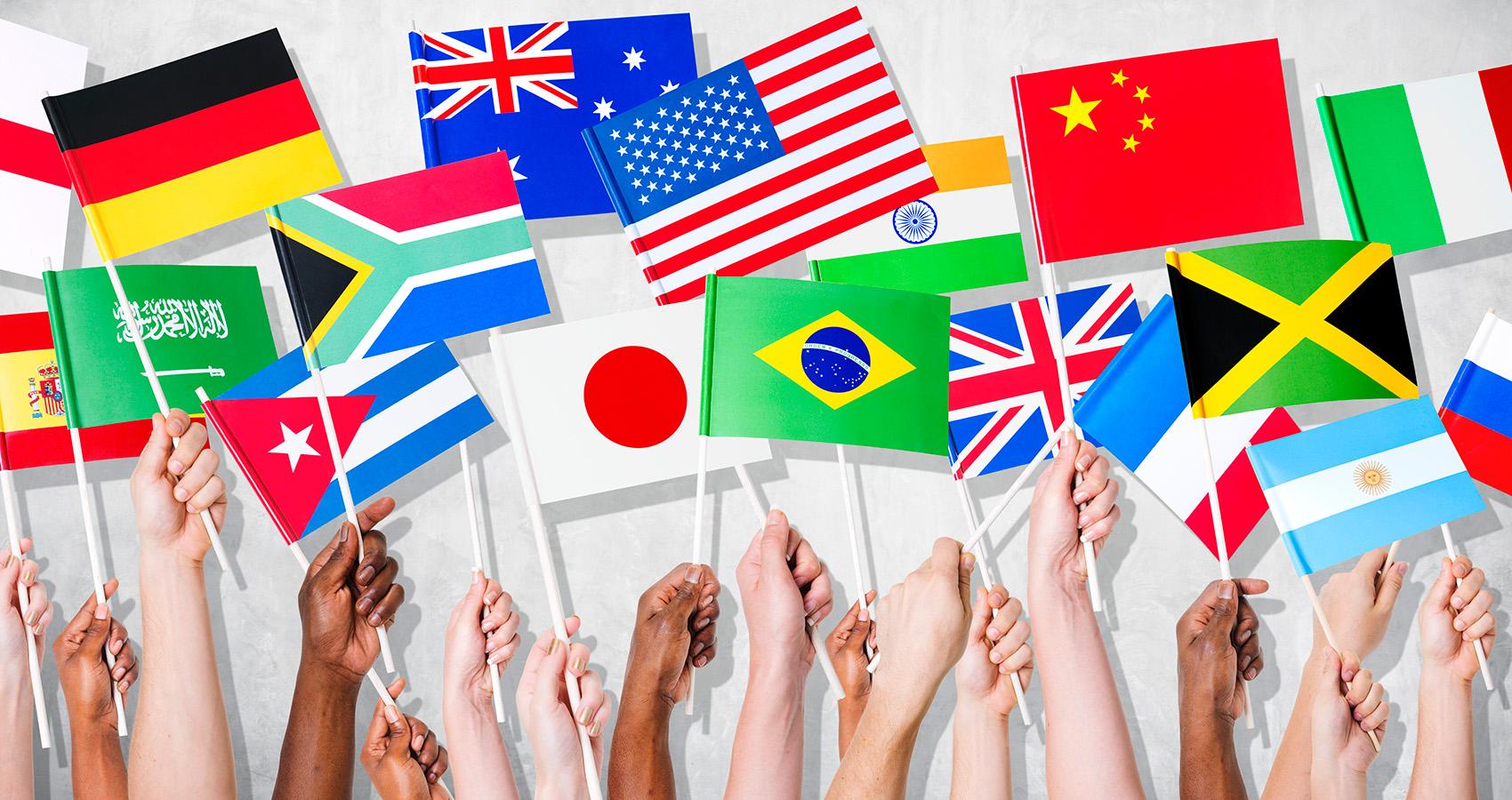 stock photo of hands holding flags from different countries