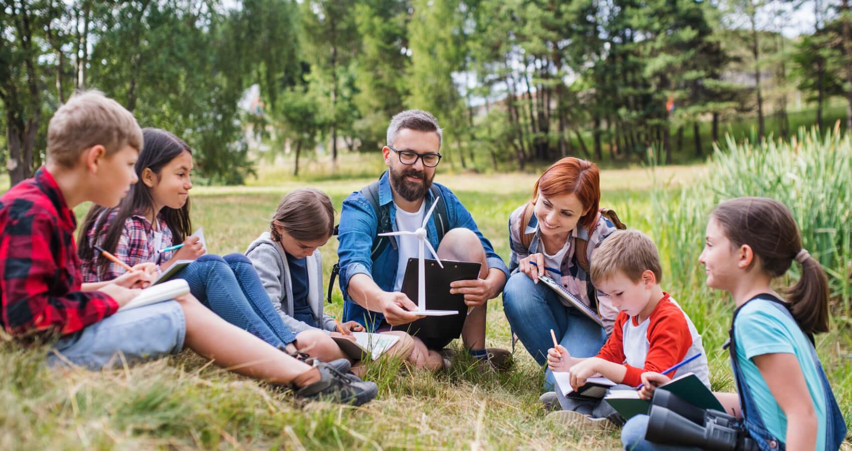 stock photo of aduts and campers outdoors