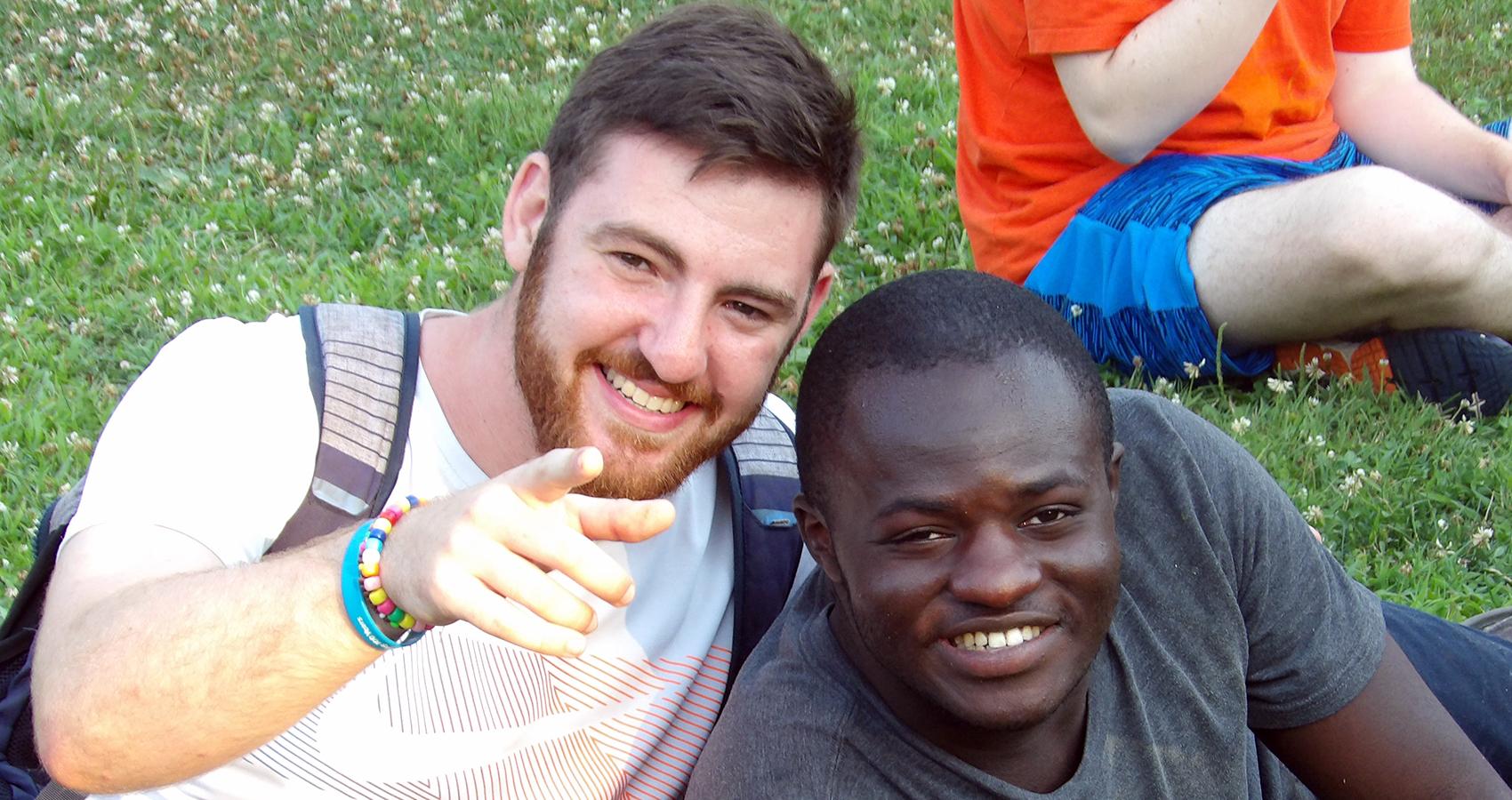 camper and counselor smiling together