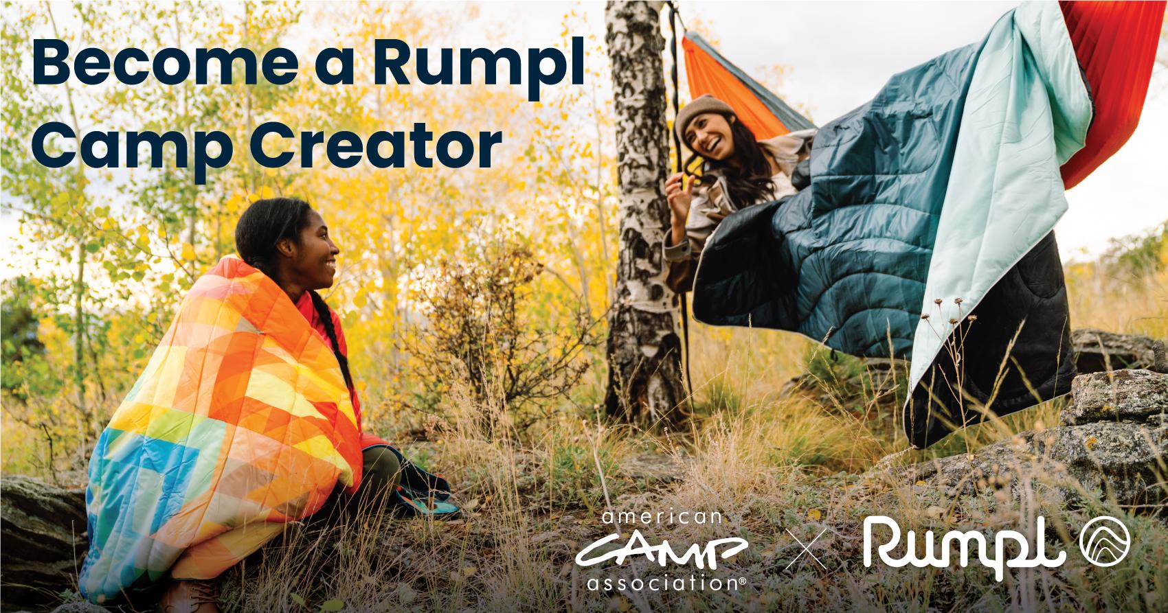 Two people wearing rumpl blankets outdoors