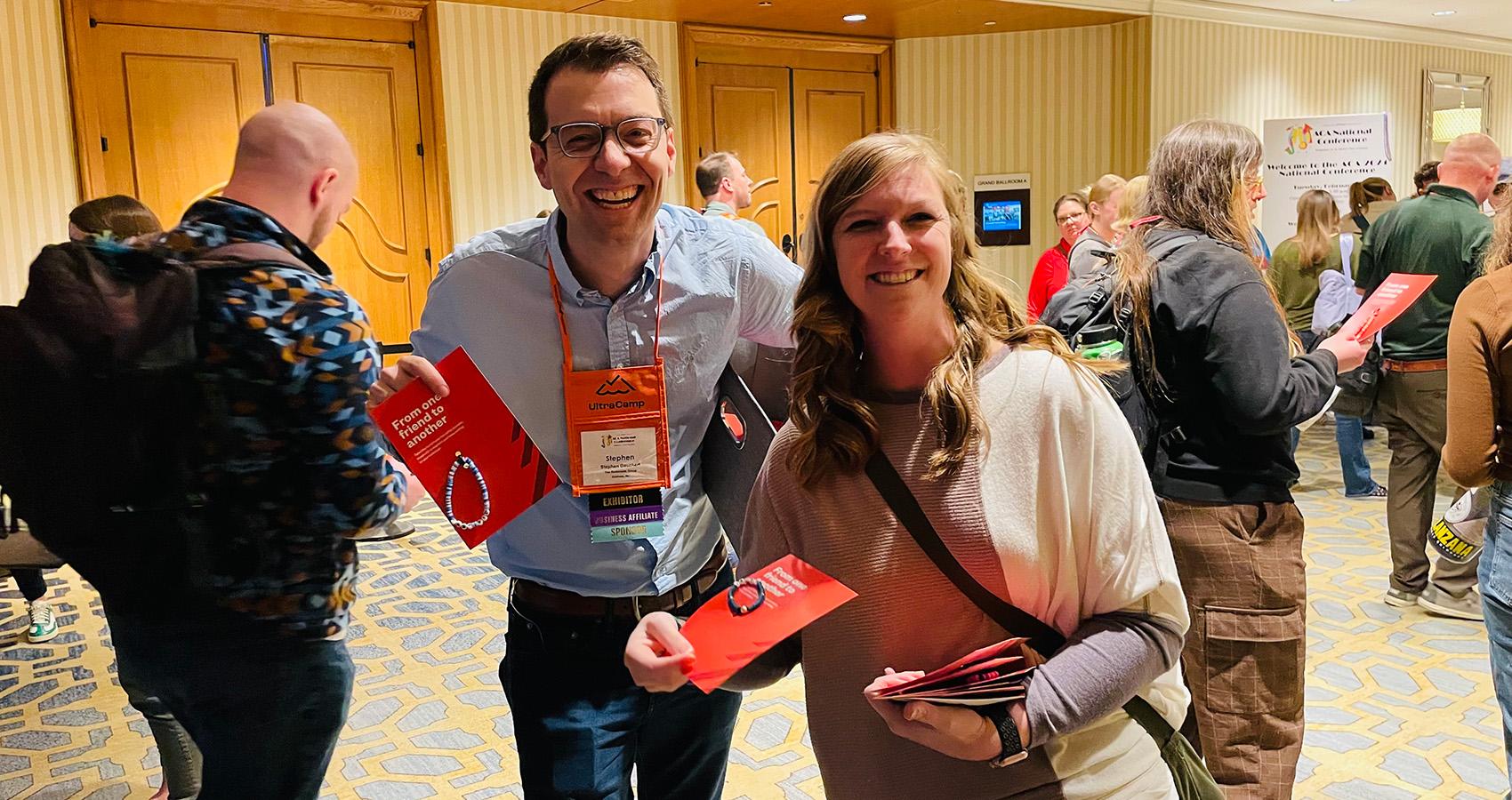 handing out bracelets at National Conference