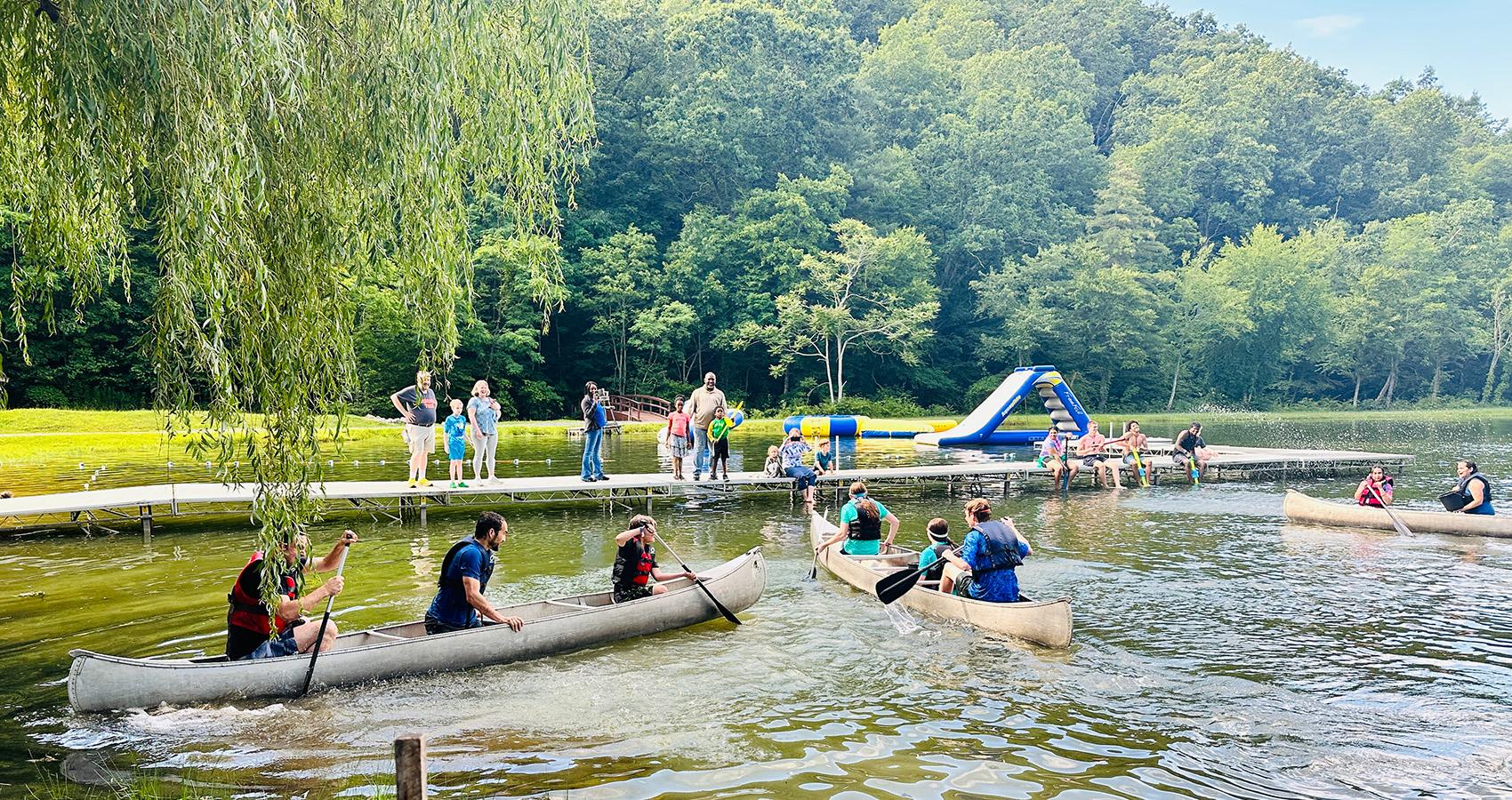 Families paddling in canoes