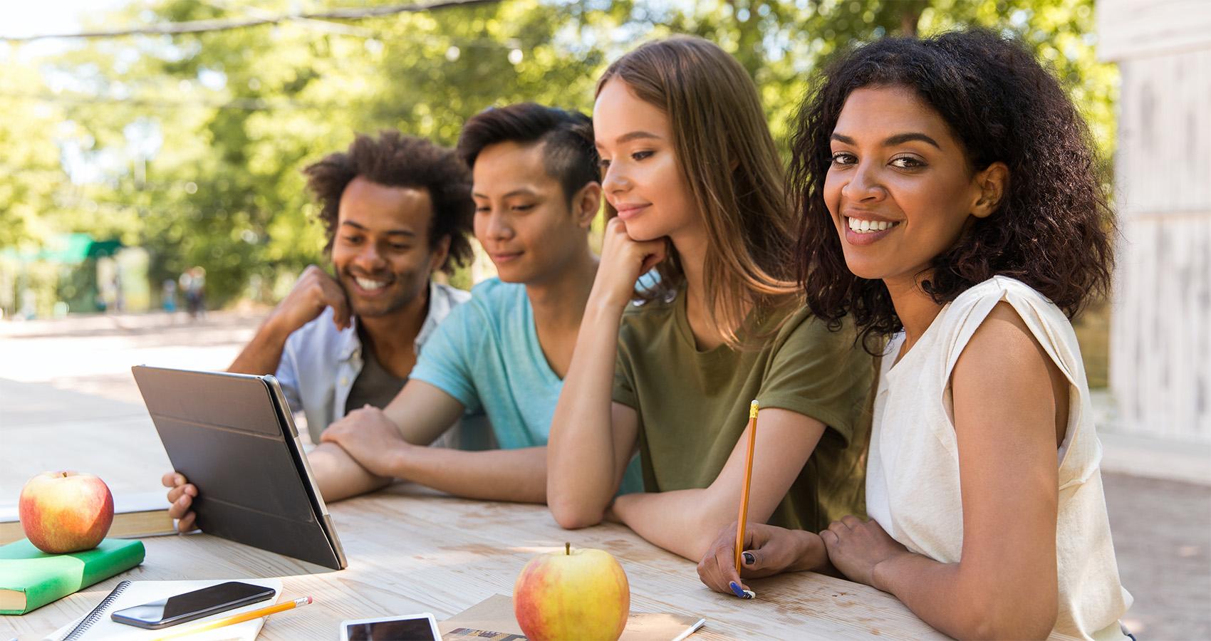 people looking at tablet together