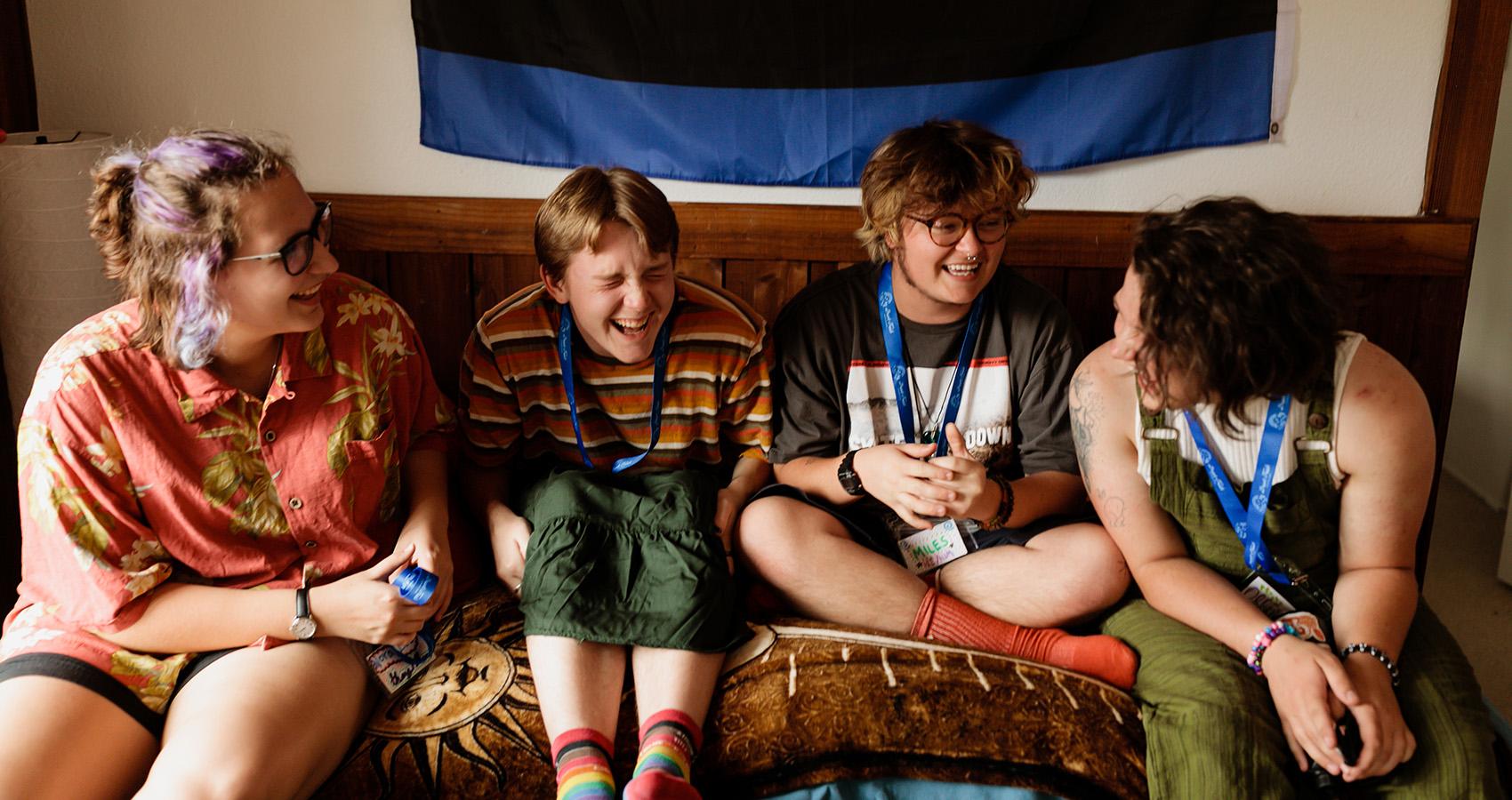 LGBTQIA campers and staff laughing