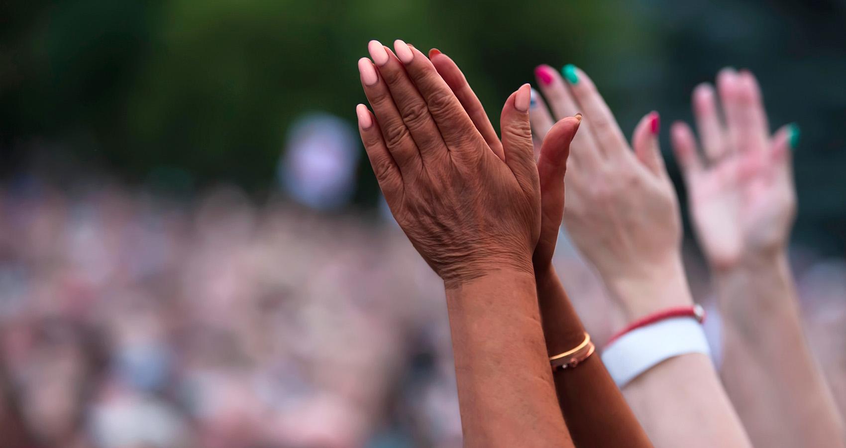 Black and white hands together