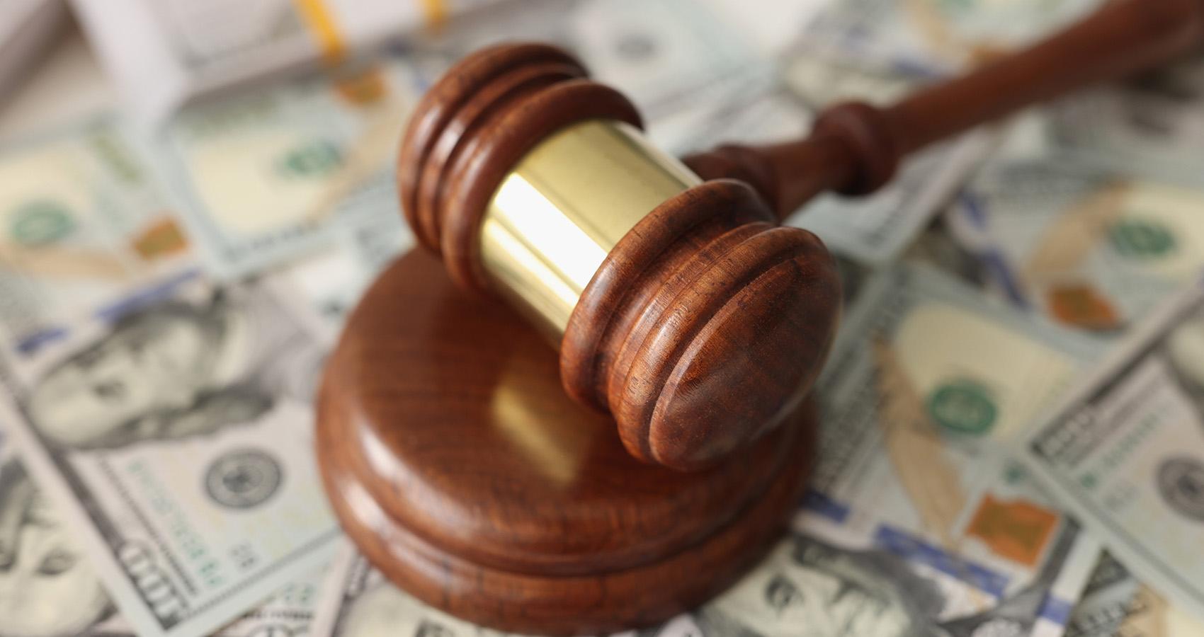 Gavel on dollar bills