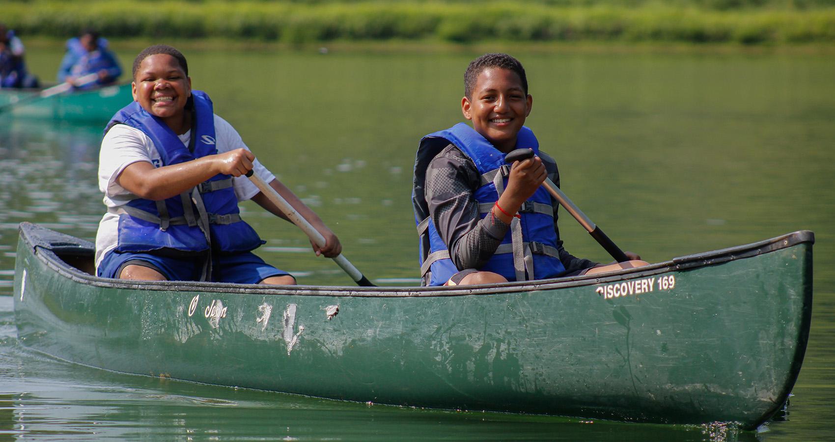 campers in canoe