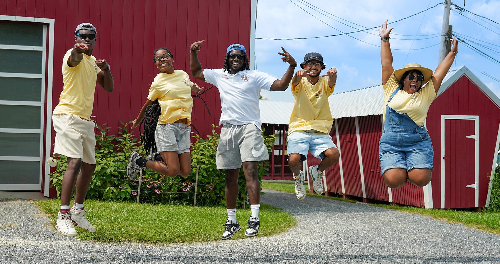 staff jumping for camera