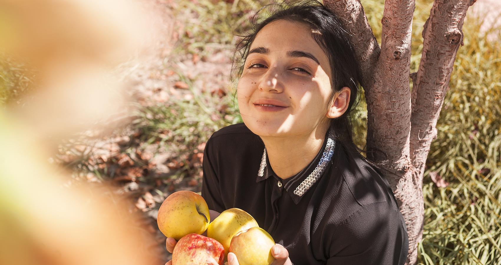 person with apples