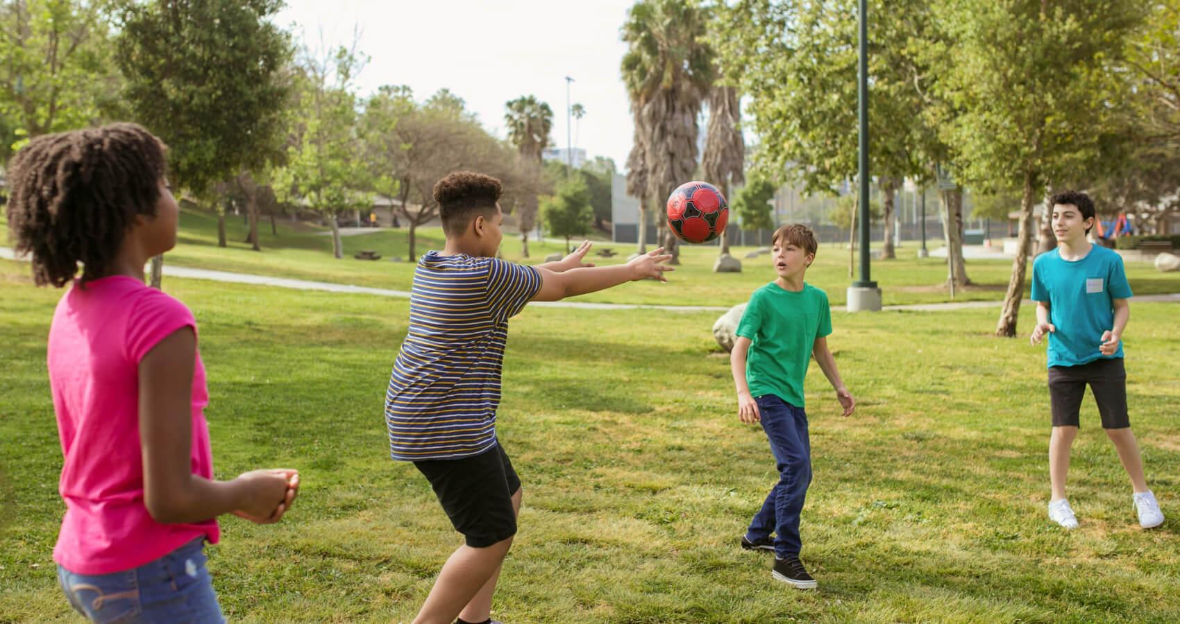 Kids playing with ball outdoors