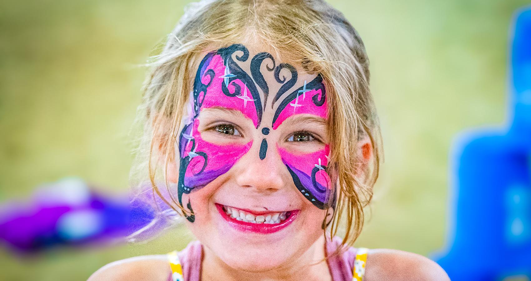 camper with butterfly face paint