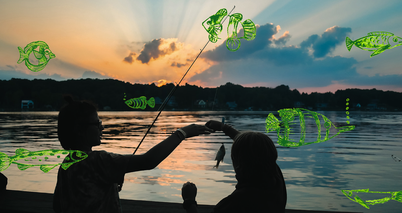 Two campers fishing at sunset