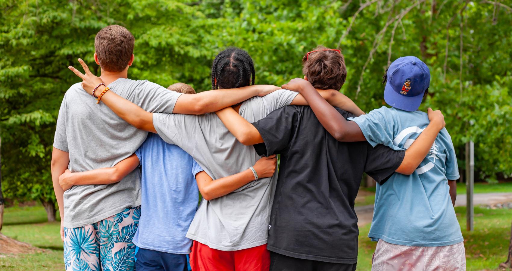 group standing together facing away from camera