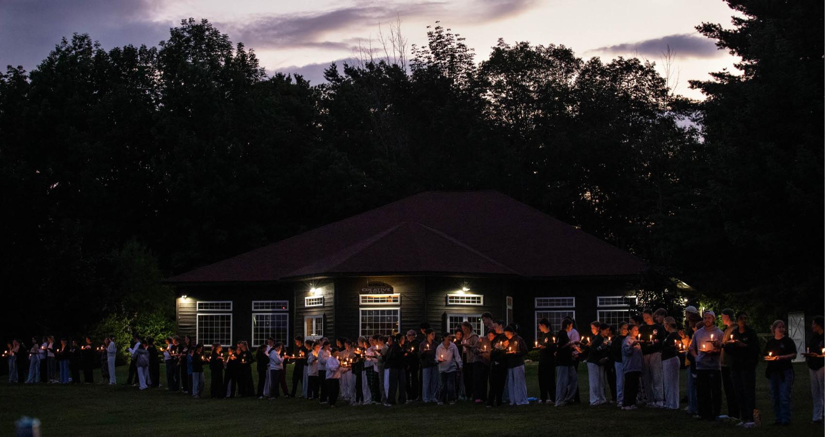 Group at night with candles