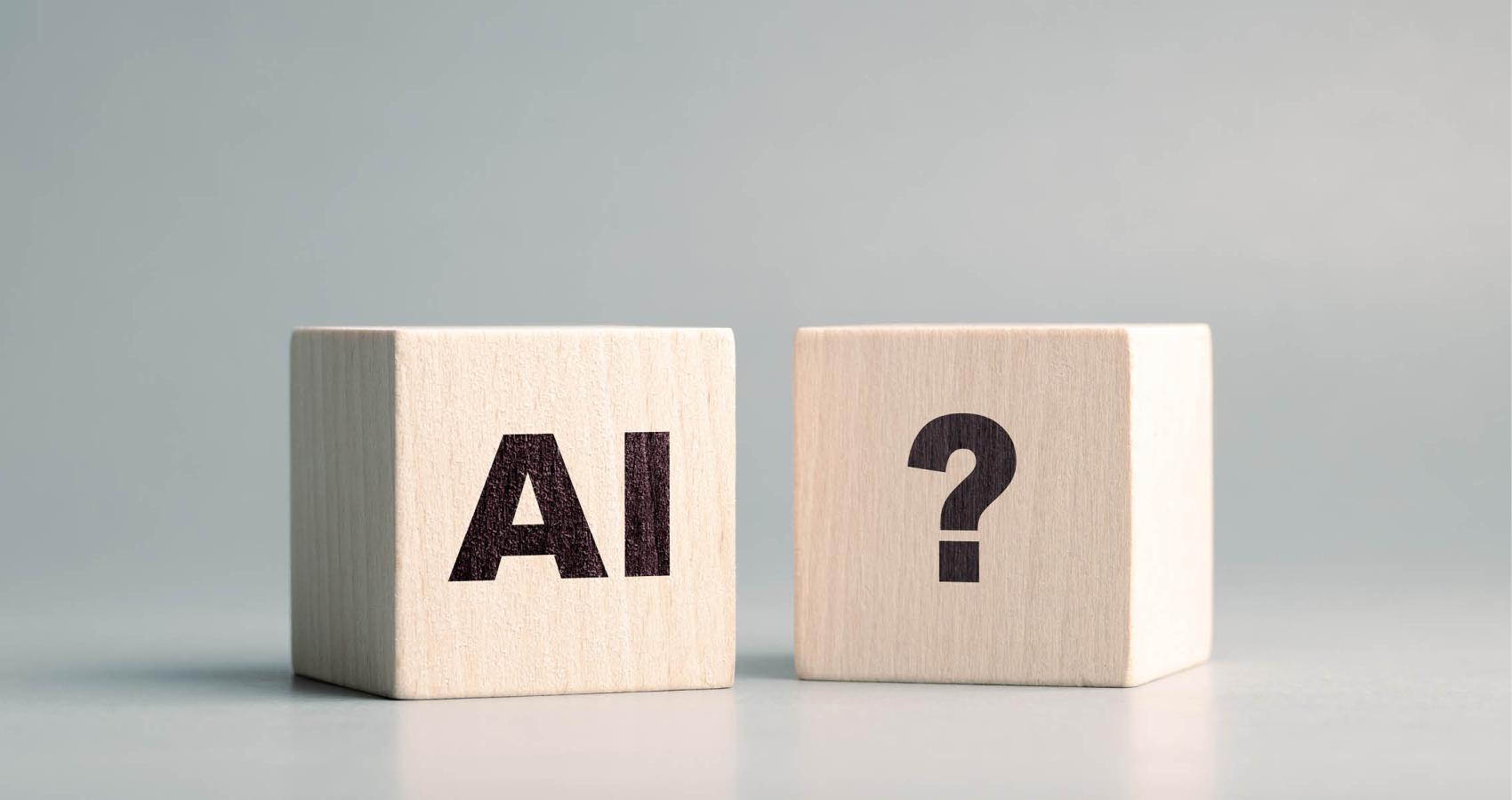 Wood blocks with "AI" and "?"