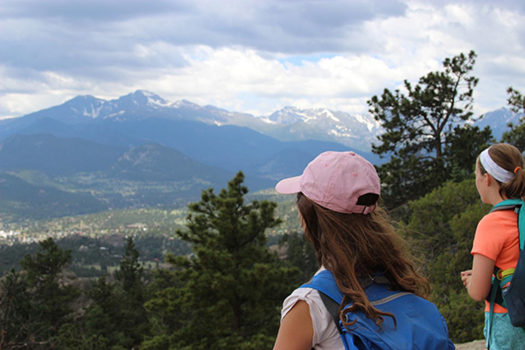 campers looking over mountains