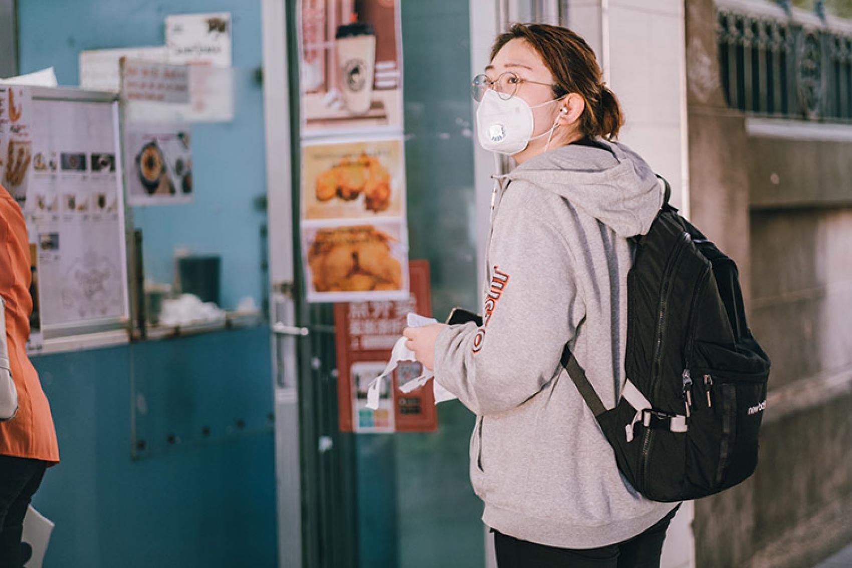 Student wearing mask in hallway