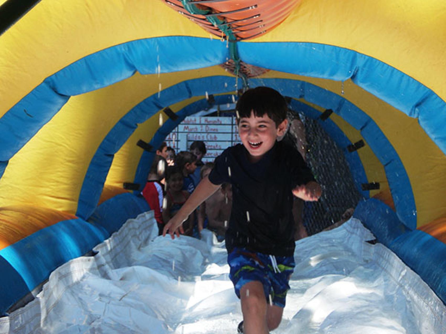 camper running through water tunnel