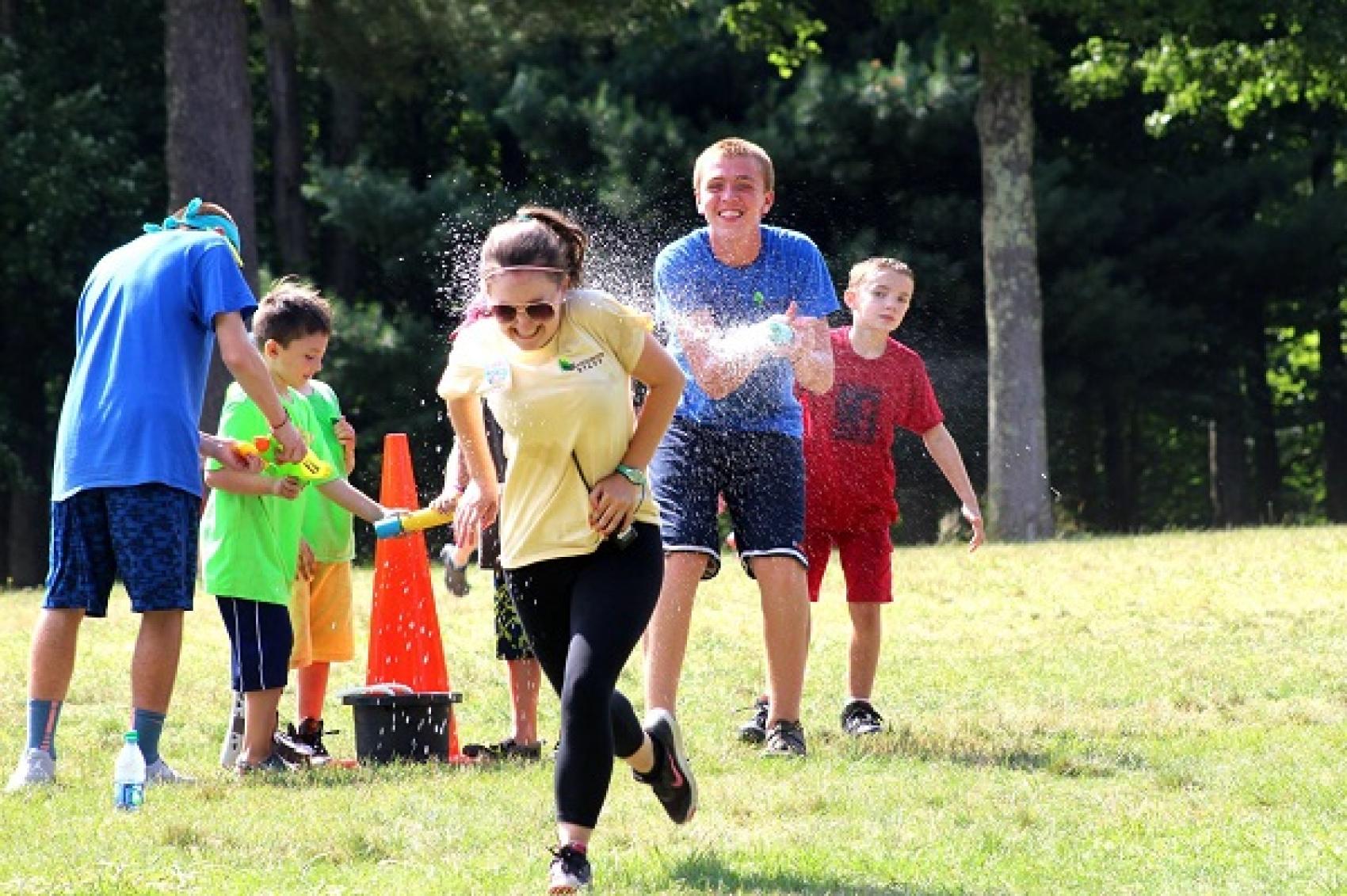 camper getting sprayed with water