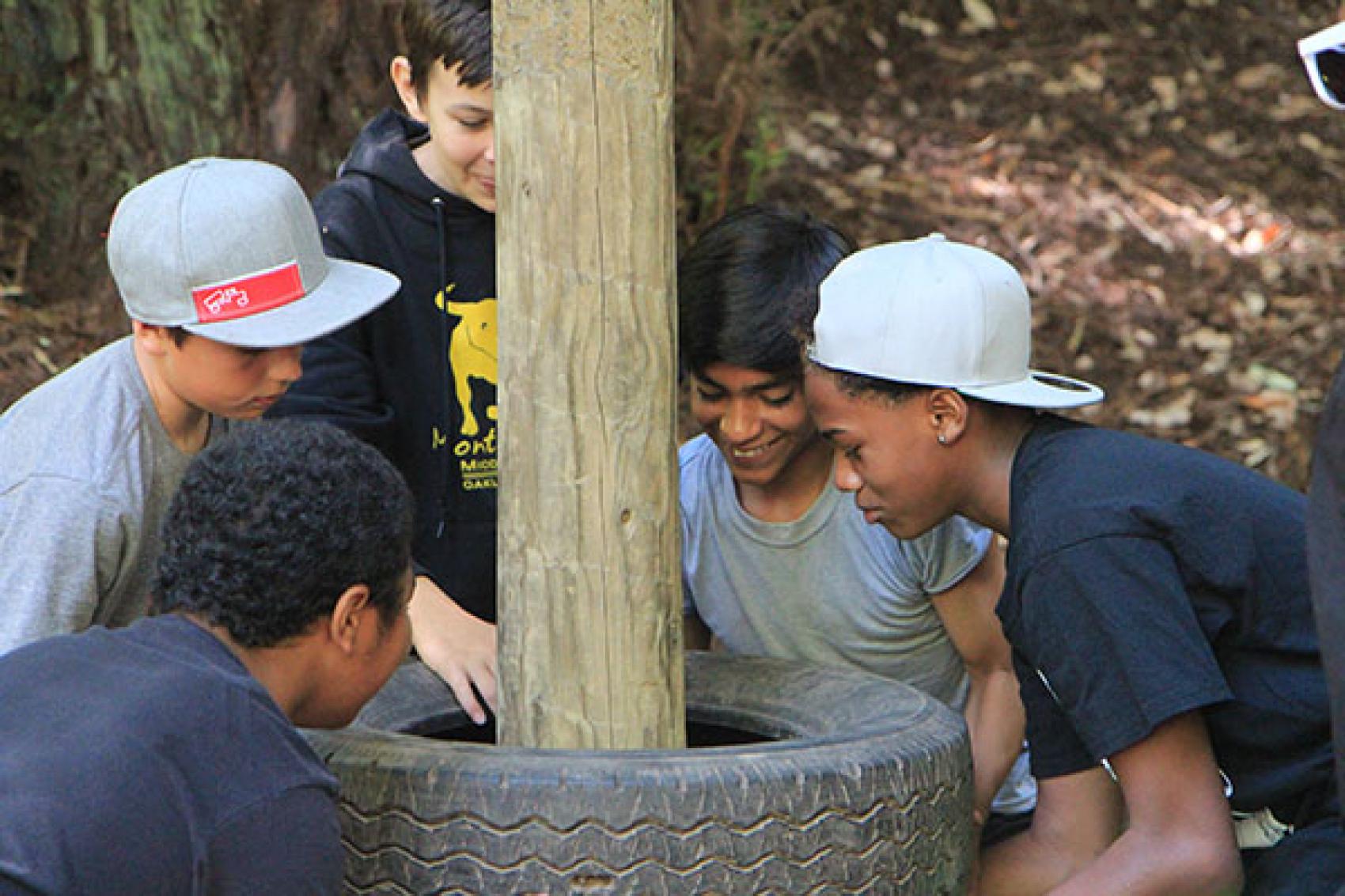 group of campers surround tires