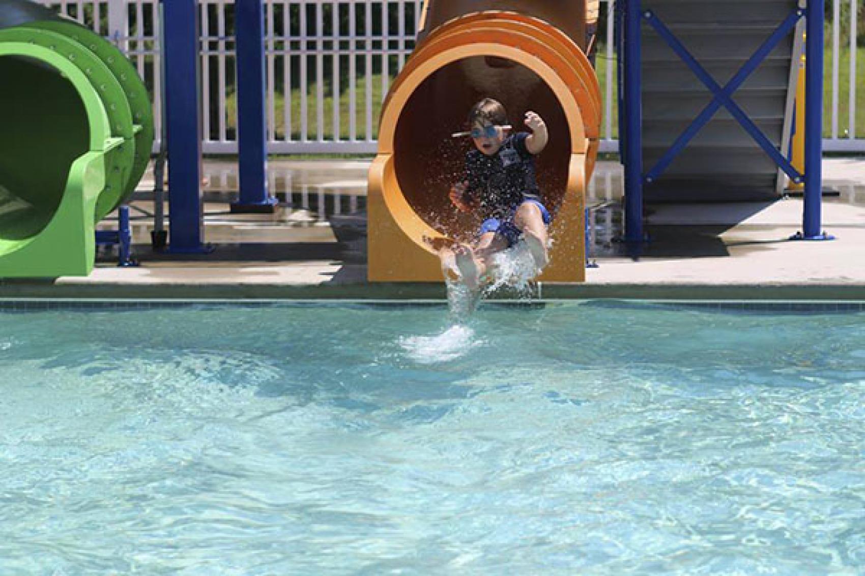 camper coming down water slide