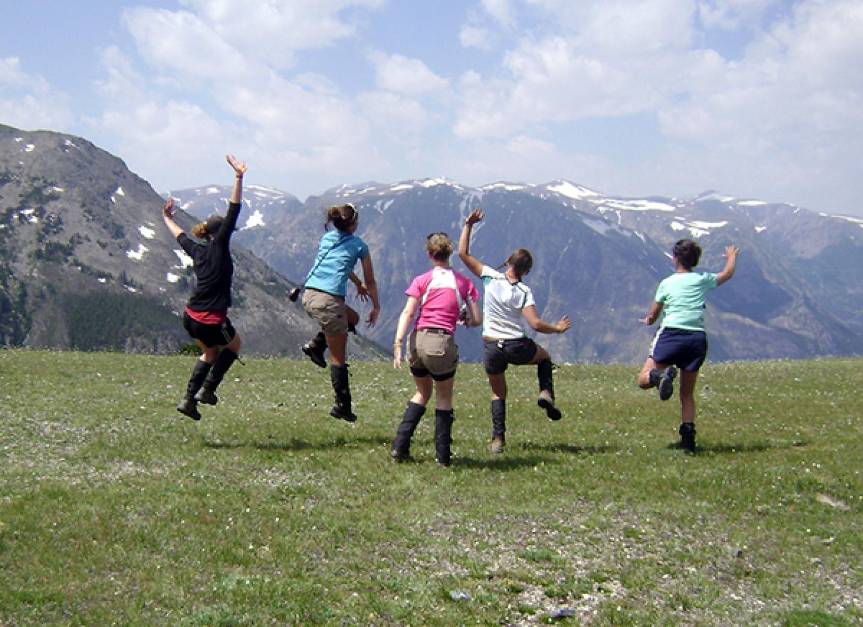 campers with mountains in background