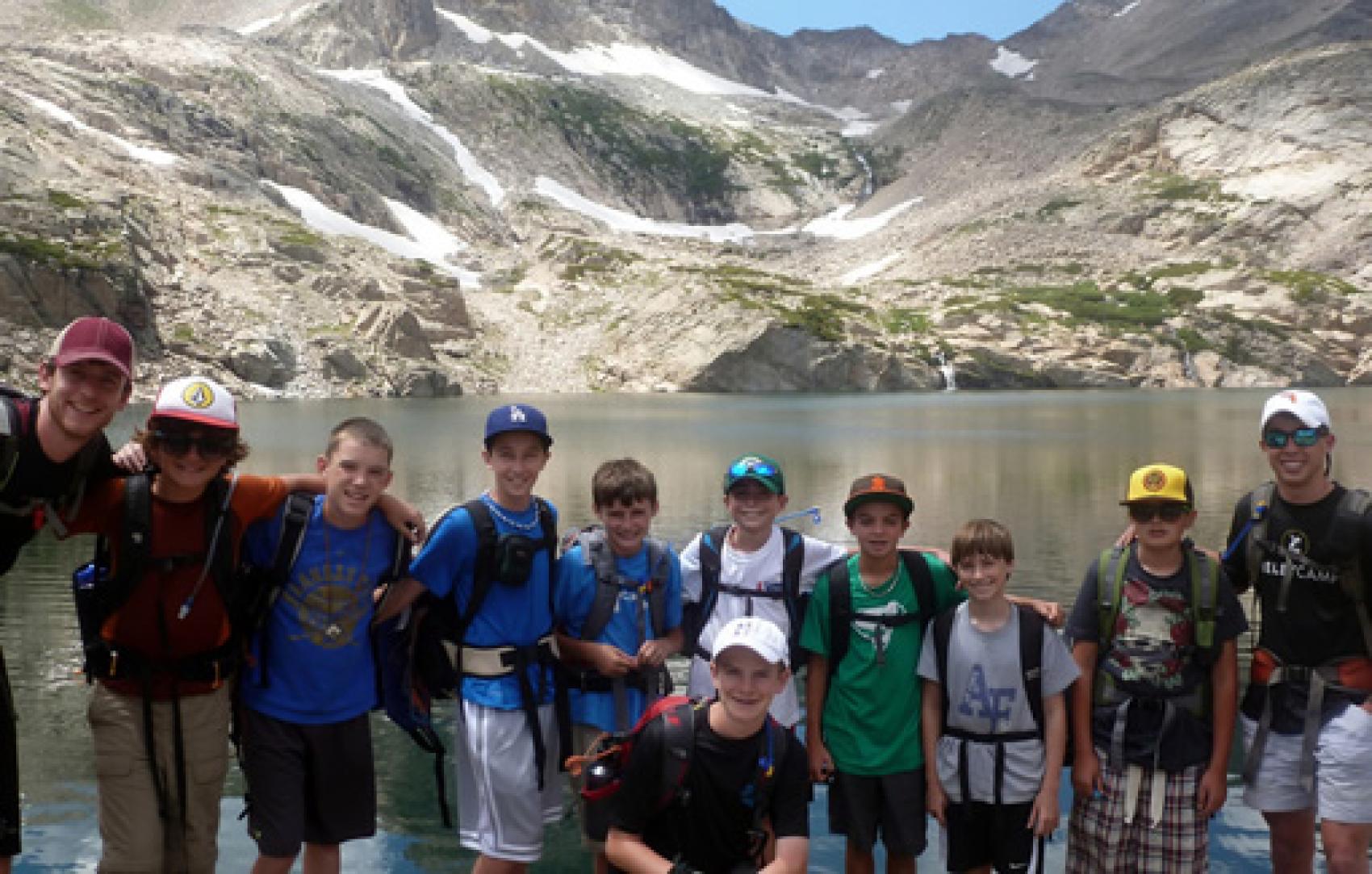 group of kids next to lake