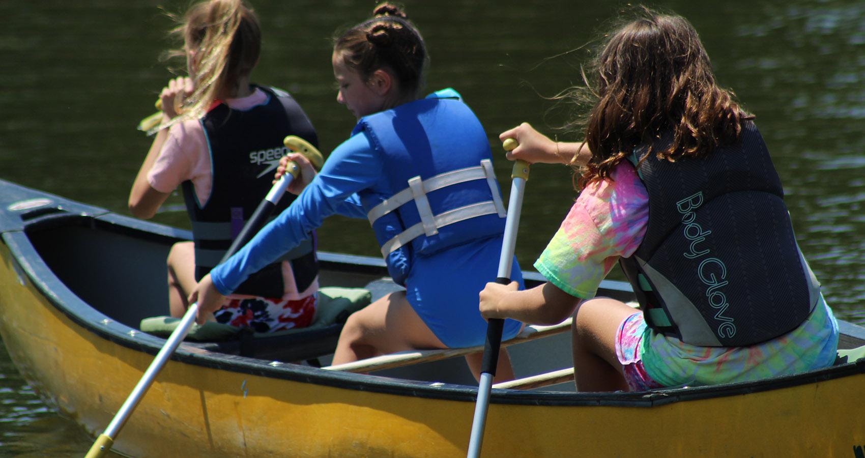 campers in a canoe