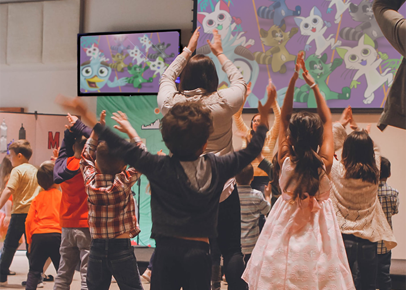 Kids exercise while following along to television