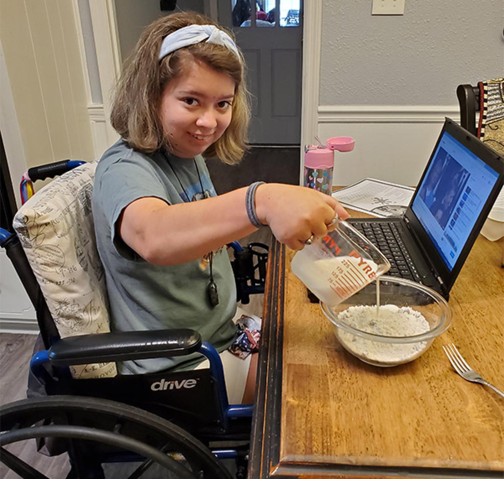 camper in wheelchair doing virtual camp activities