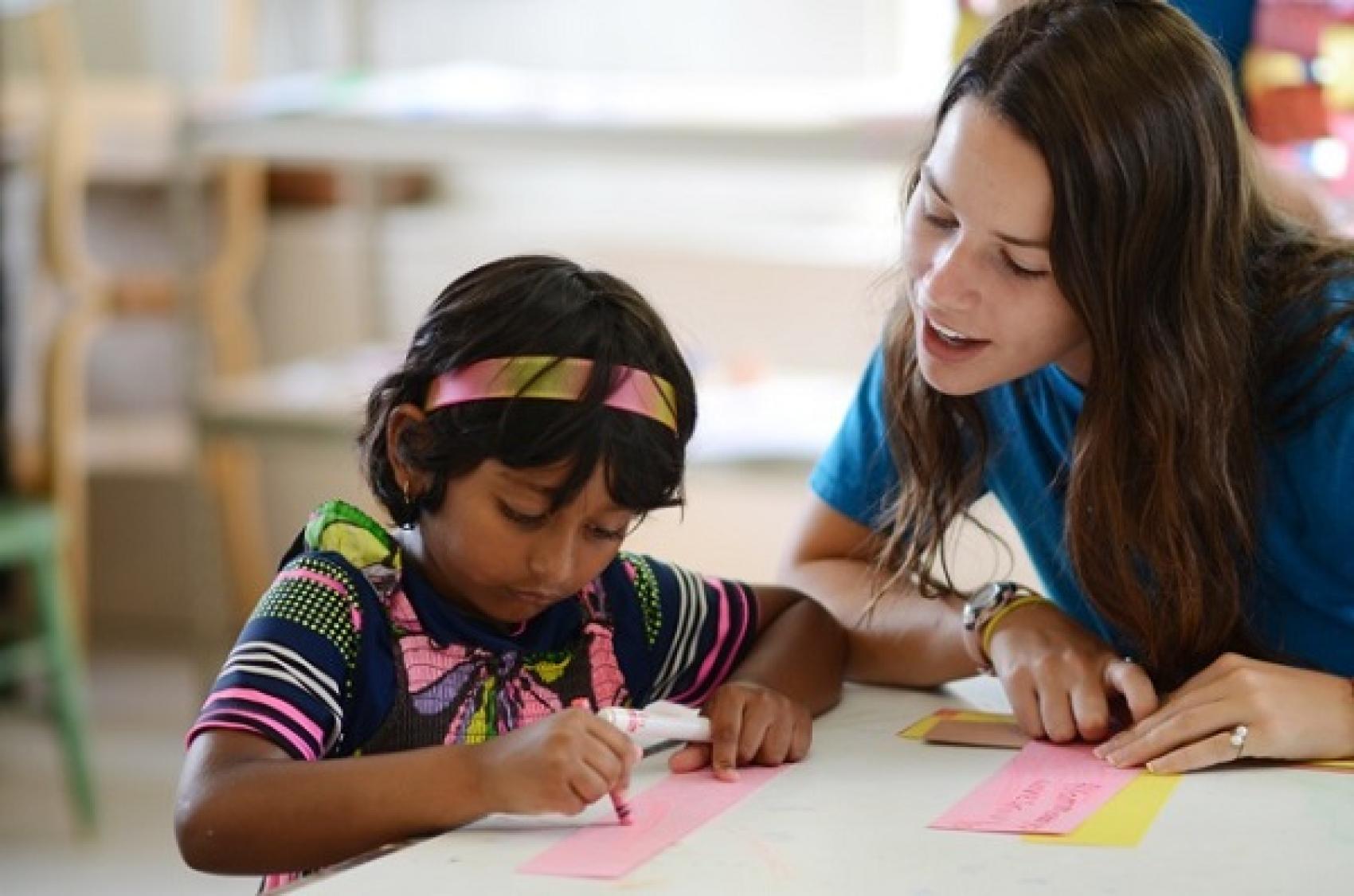 teacher helping student