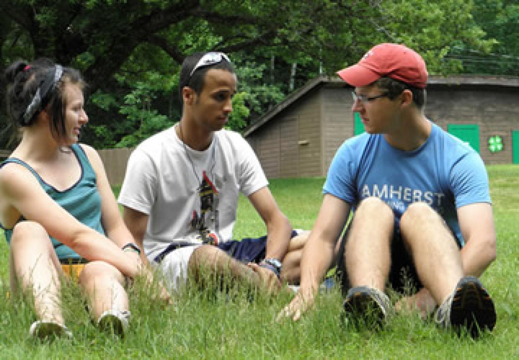 Camp staff sitting and talking to each other