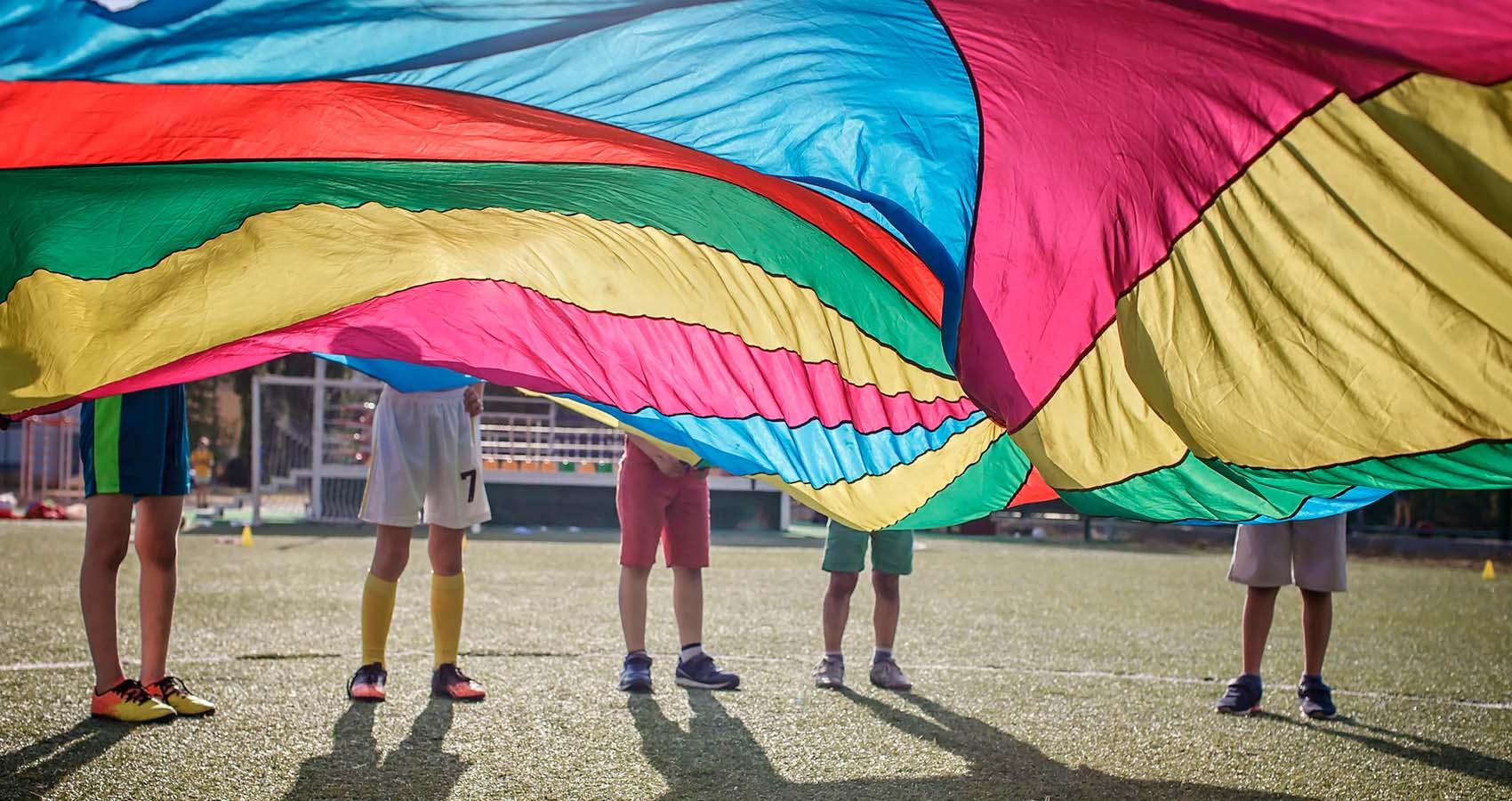 kids playing with parachute