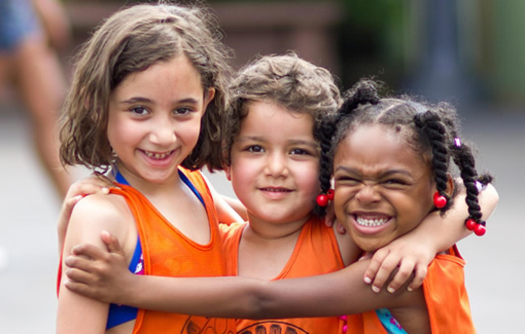 3 girls hugging and smiling