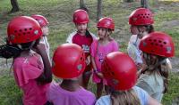 Campers in climbing helmets