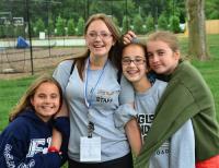 campers and counselor smiling for camera