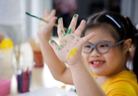 Girl with paint on her hands