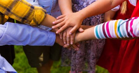 Children with hands together