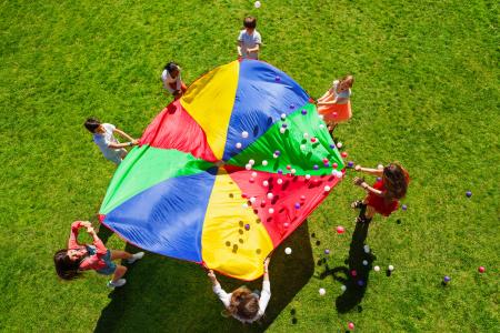 Youth playing with parachute