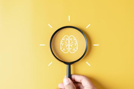 Magnifying glass on human brain