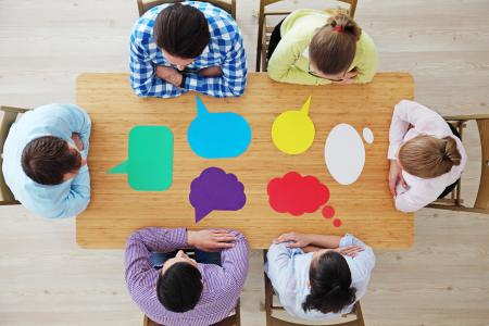 People talking at a table