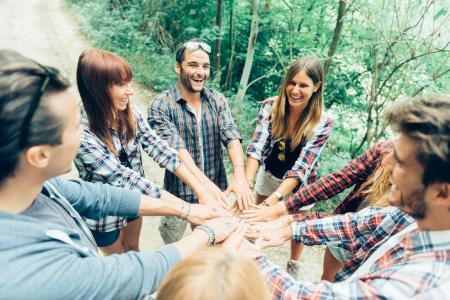 Young adults hands in circle