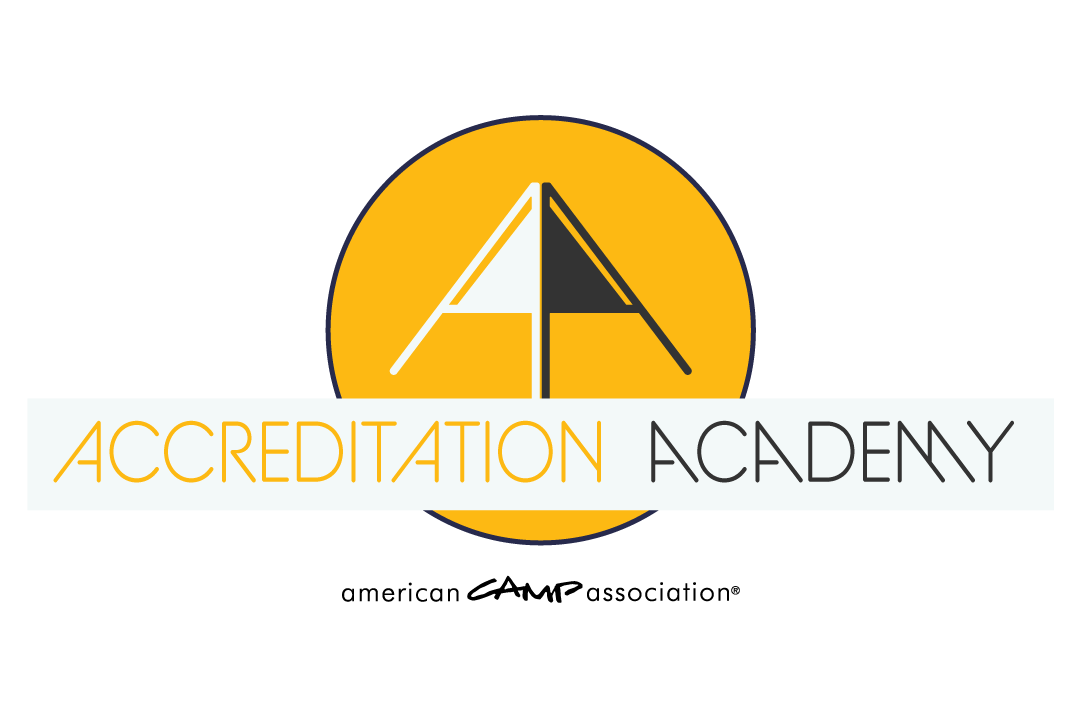 Yellow circle with a two-tone arrow in the middle and Accreditation Academy text overlaid on blue bar