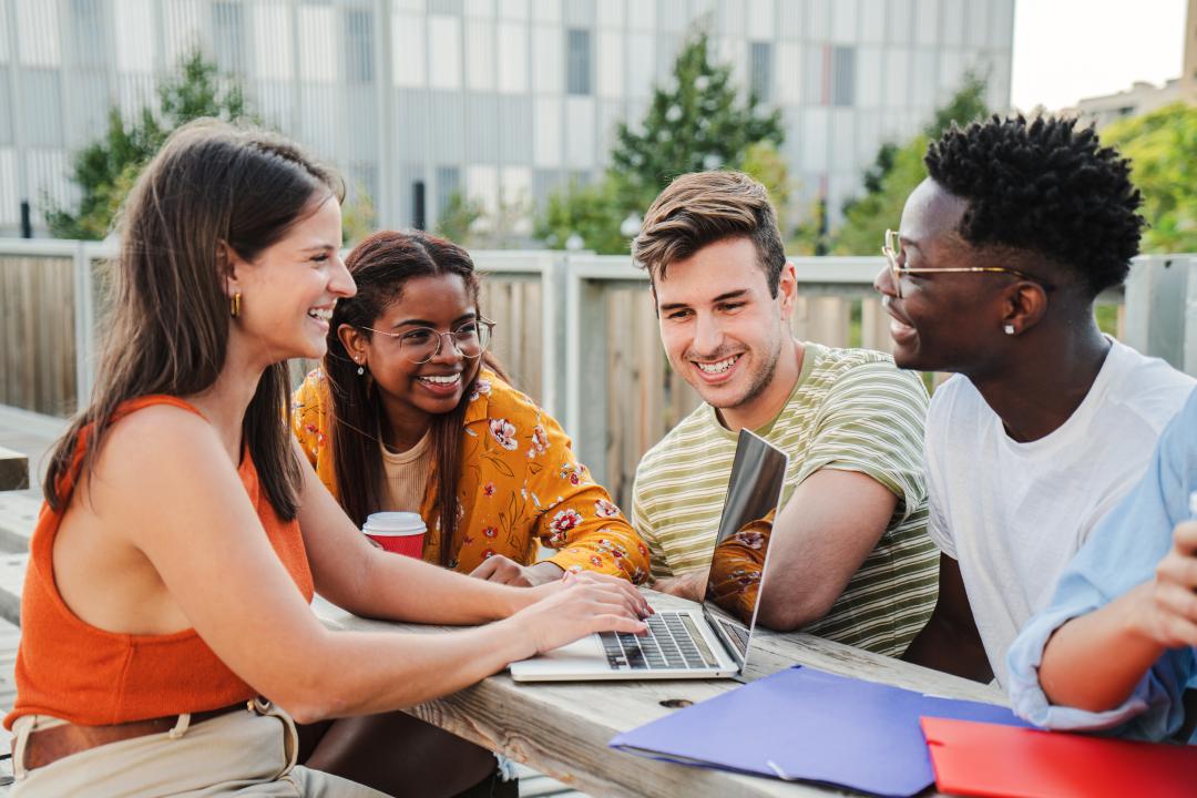 adult learners sitting outside