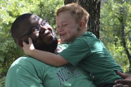 counselor and camper hugging