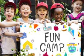 campers with fun camp sign