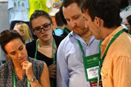 A vendor talking with attendees